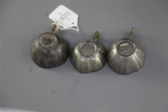 Three Chinese Yixing pewter and jade mounted cups, Daoguang period (1821-50), w. 8cm-8.6cm